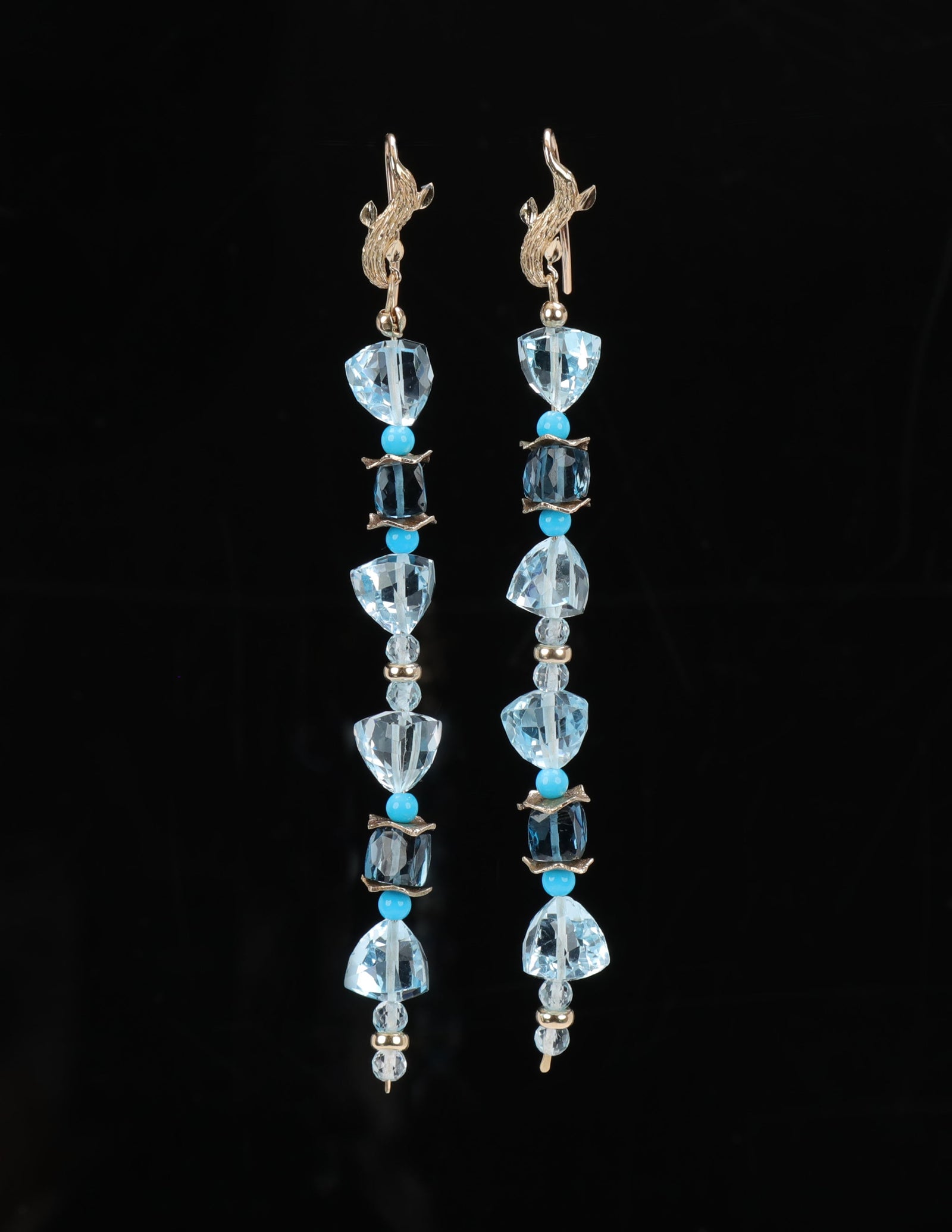 Sky and London blue topaz sparkle against Sleeping Beauty turquoise to create a drop ear wire, approximately 4” long.  14kt yellow gold.  White Orchid Studio’s vanilla bean ear wires and spacers.