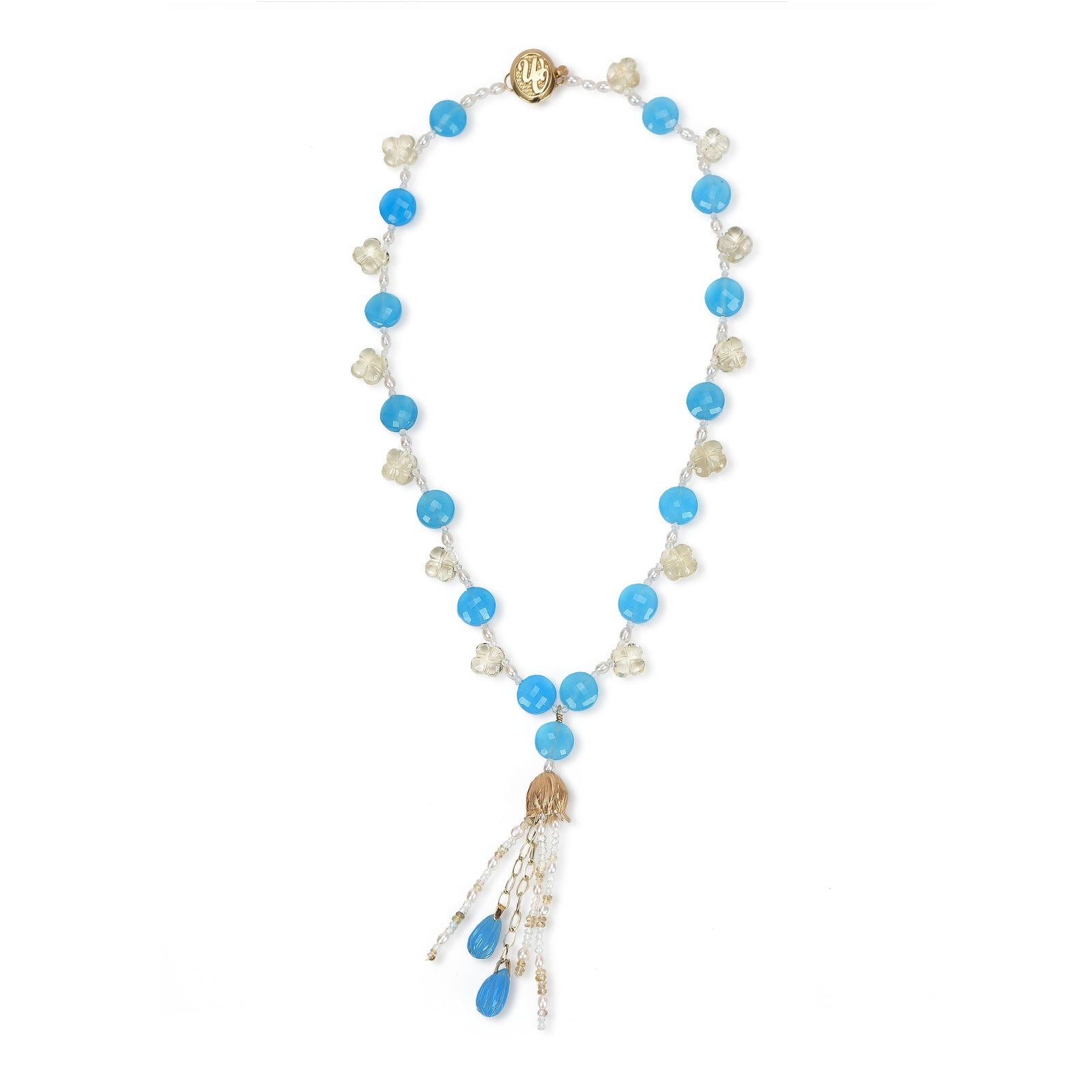 14kt yellow gold choker necklace (16”) with a tassel (3”). Gems: blue chalcedony, carved scapolite, white topaz, and pearl.