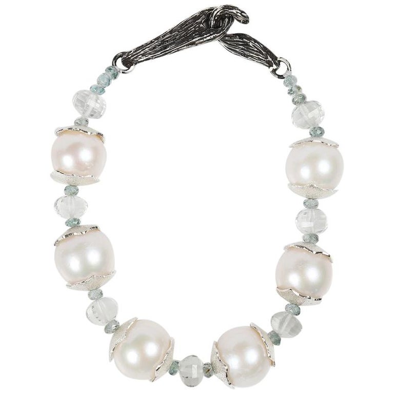 Gem bracelet: freshwater pearls (11mm), prasiolite, and apatite. White Orchid Studio’s vanilla bean clasp and custom spacers in sterling silver. 8.5.”