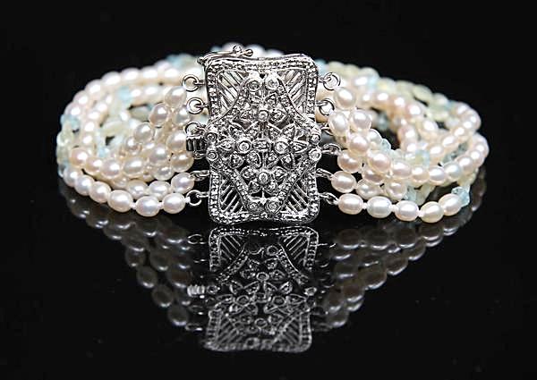 Pearl, blue topaz, chrysoberyl, diamonds (.41ct total weight), and gold bracelet. 14kt white gold. 8”