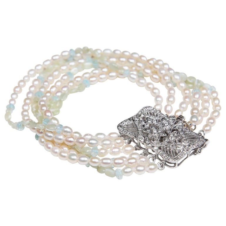 Pearl, blue topaz, chrysoberyl, diamonds (.41ct total weight), and gold bracelet. 14kt white gold. 8”