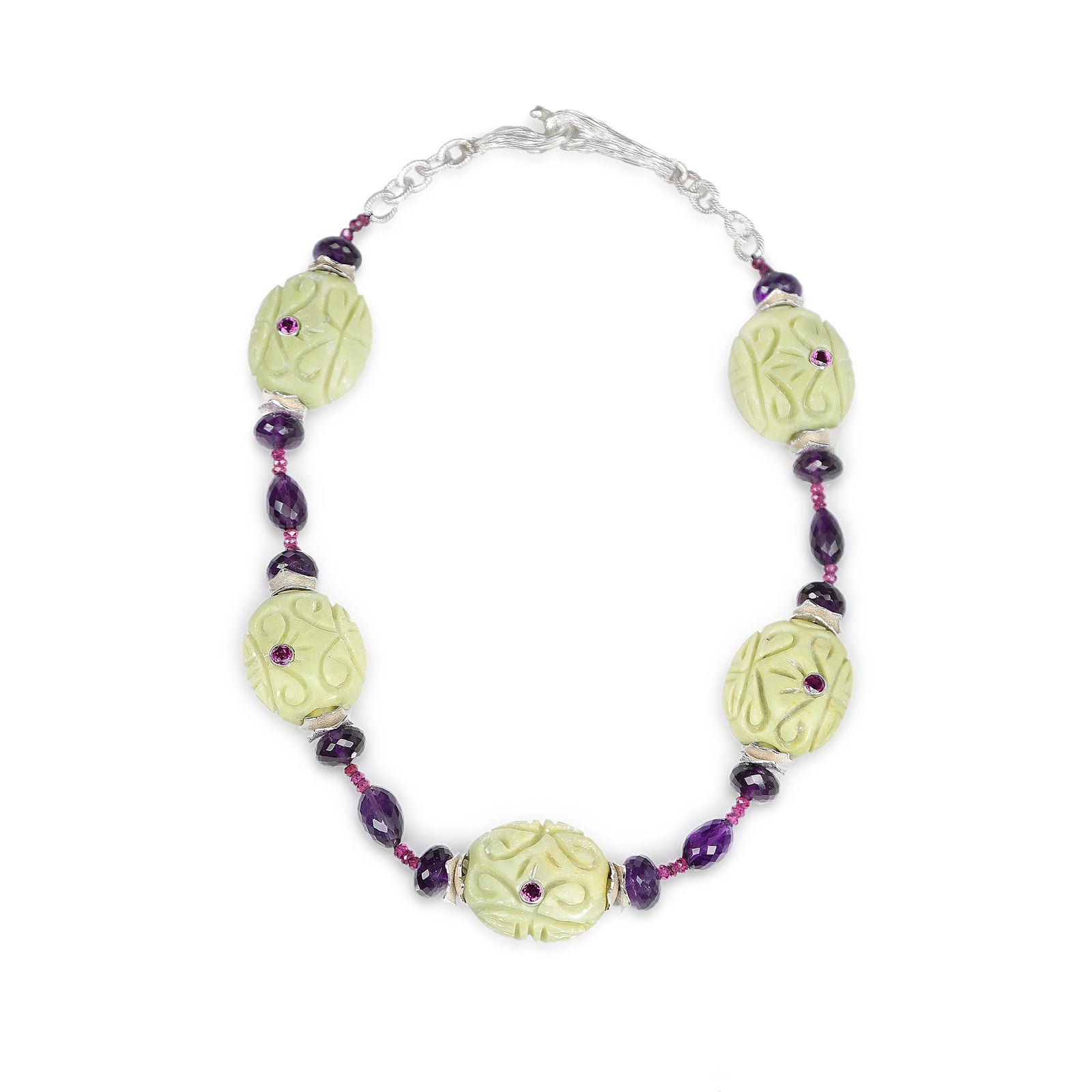 Sterling silver: textured silver chain. Gems: Mojave turquoise, Malaya and almandine garnet, and amethyst. White Orchid Studio’s vanilla bean clasp and wave spacers. Approximate length: 19.5”