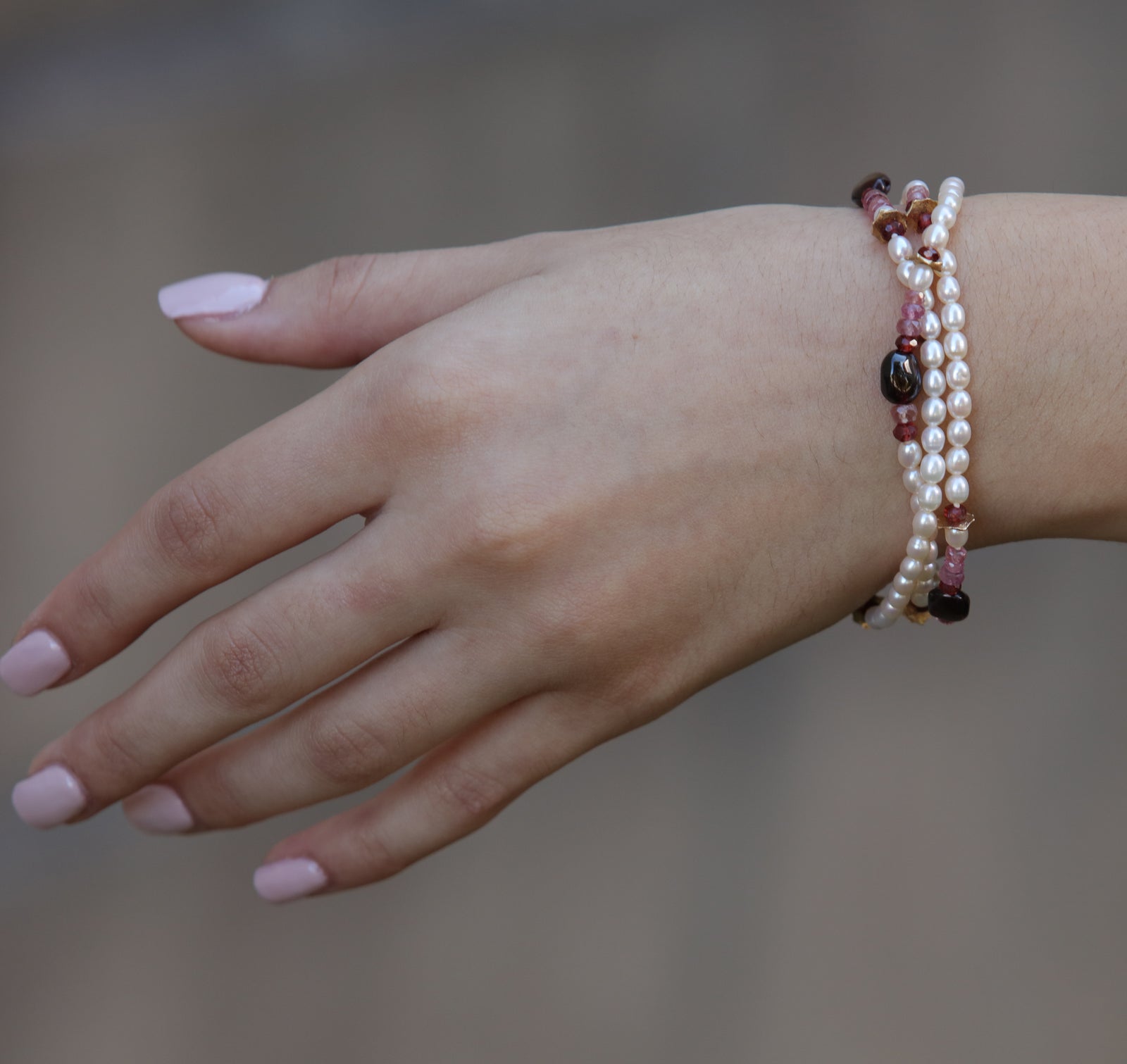 Charming: A Bracelet of Frreshwater Pearl, Pink Tourmaline, Rubies, Garnet, and Gold