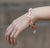 A Pocket of Sunshine: A Pearl, Rhodochrosite, Sunstone, and Gold Bracelet