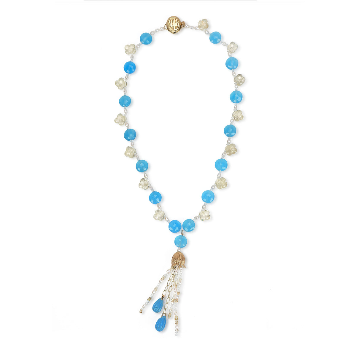 14kt yellow gold choker necklace (16”) with a tassel (3”).  Gems: blue chalcedony, carved scapolite, white topaz, and pearl. 