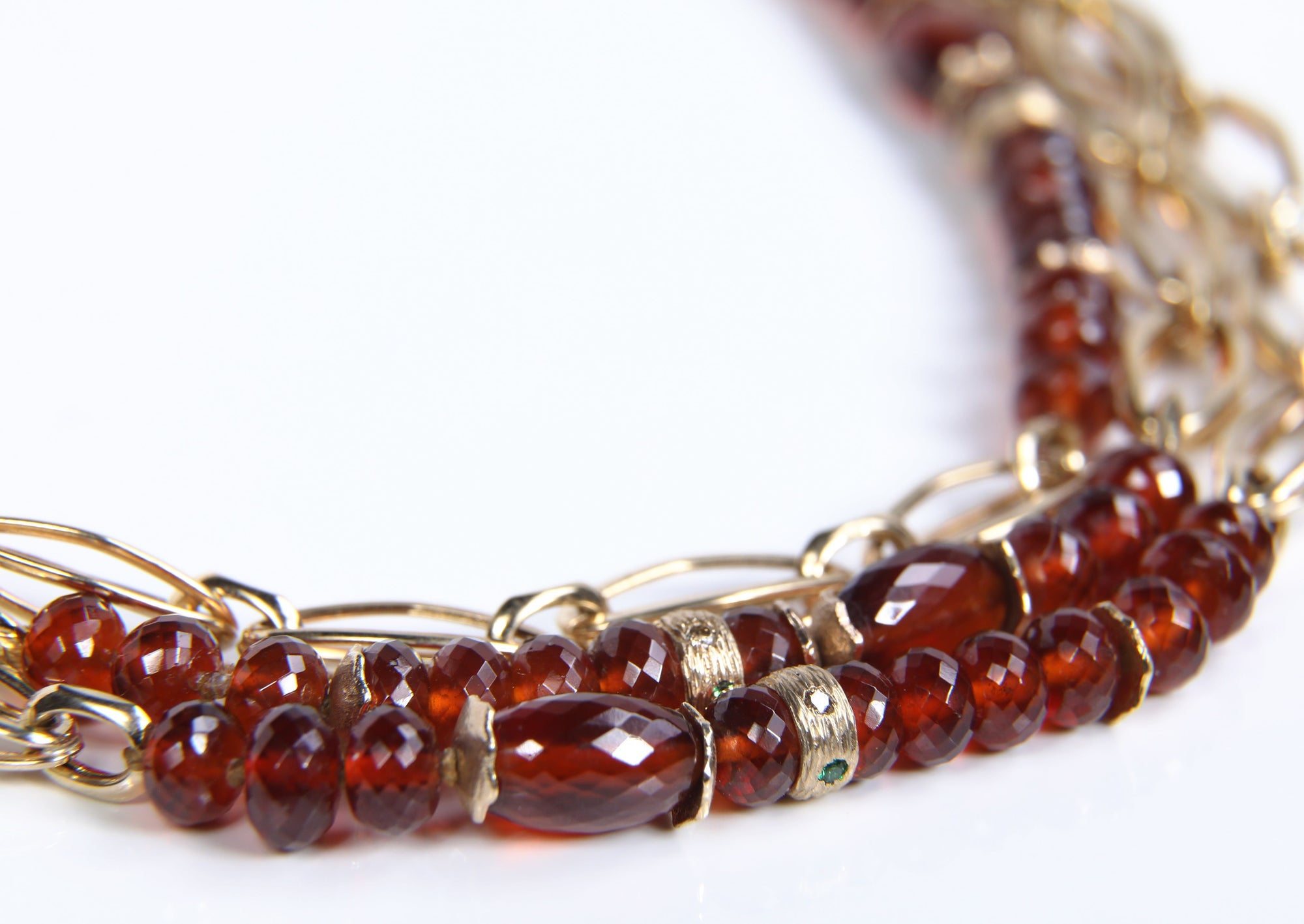 14kt yellow gold. Italian gold chain.  Spessartite and tsavorite garnets, and Champagne diamonds. White Orchid Studio logo clasp, wave spacers, and rondelles.  19.5”