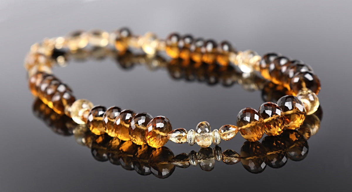 14kt yellow gold.  Gems: whiskey quartz and citrine. Gold spacers and White Orchid Studio’s vanilla bean clasp.  Approximate length 18”